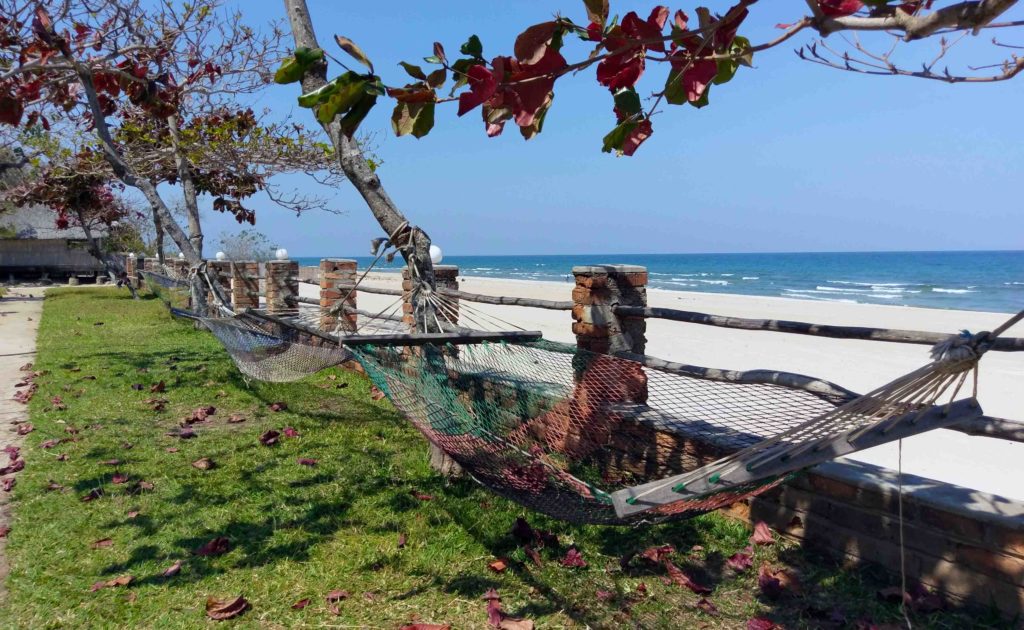This is a hammock and the beach of Kande Beach in the north of Malawi.